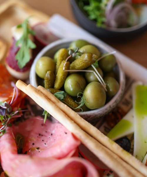 Vibrant Mediterranean mezze platter featuring a variety of fresh, colorful appetizers.